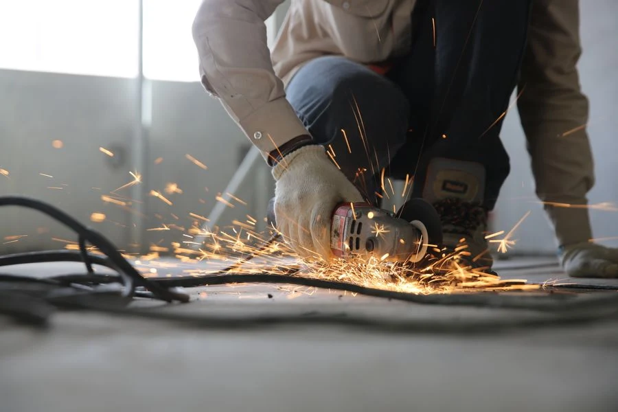 Angle grinder throwing sparks on a construction site