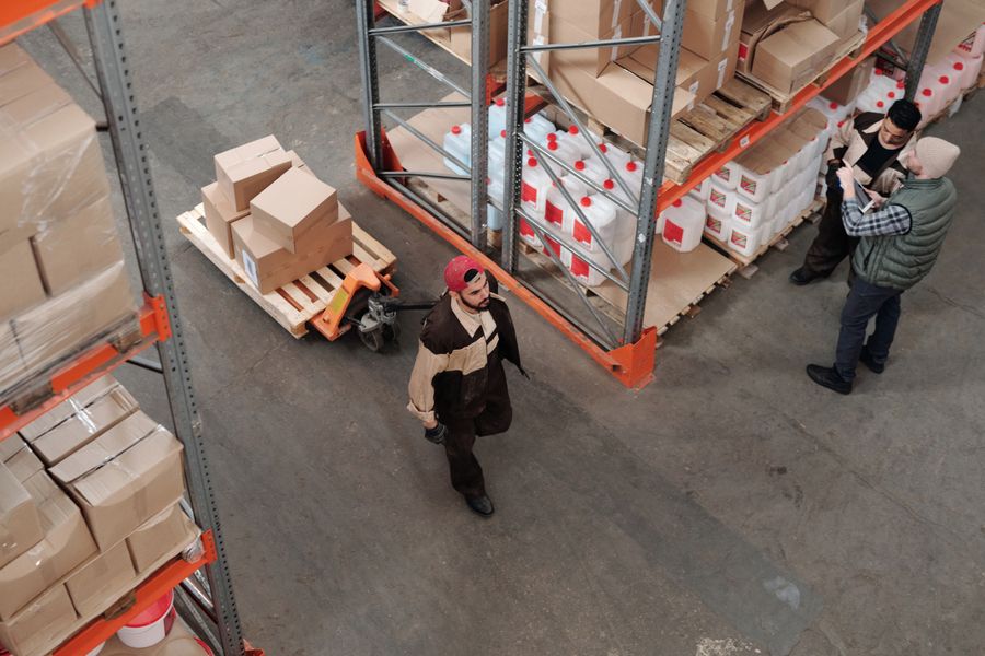 Warehouse team moving a pallet of materials
