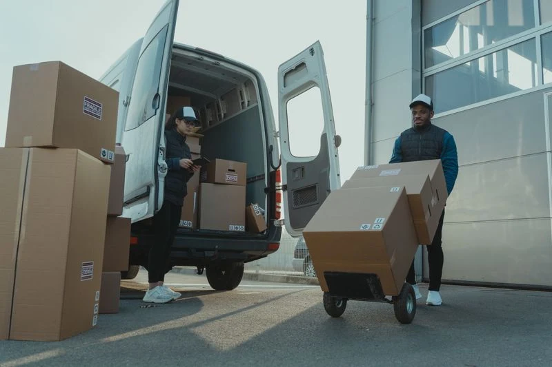 Van being loaded with materials for a site delivery
