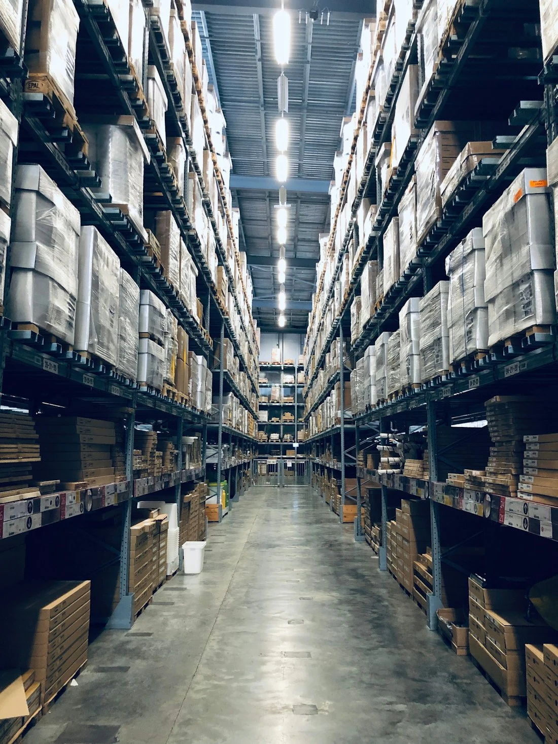 Warehouse aisle with organised shelving