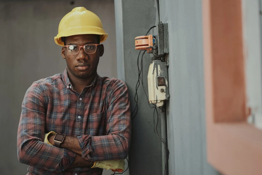 Tradesperson in a hard hat on a work site