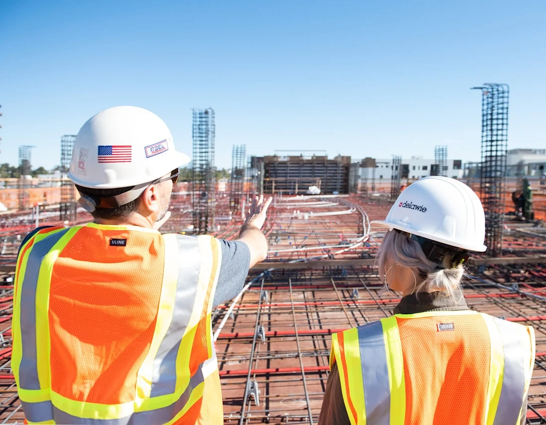 Site supervisors reviewing progress on a construction deck