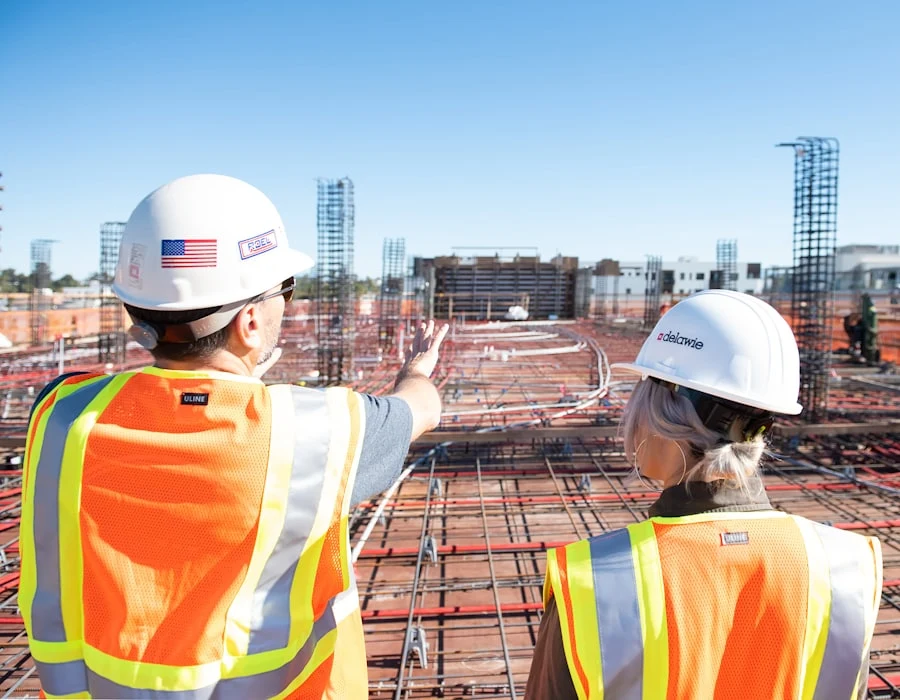 Two project managers reviewing progress on site